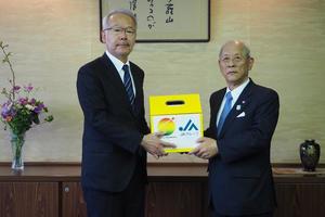 福島中央テレビ 佐藤常務取締役(左)とJA福島五連 結城副会長(右)の内容を表示